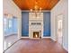 Dining room with a fireplace, tile floors, and chandelier at 103 N Magnolia Ave., Andrews, SC 29510