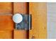 Close up on a doorknob with an old style lock and a white handle on a wooden door at 103 N Magnolia Ave., Andrews, SC 29510