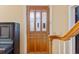 Entryway featuring a wood door with glass panes and stairs at 103 N Magnolia Ave., Andrews, SC 29510