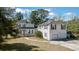 A two-story home with a detached two-car garage connected by walkway at 103 N Magnolia Ave., Andrews, SC 29510
