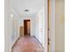Hallway with tile flooring and multiple doors at 103 N Magnolia Ave., Andrews, SC 29510