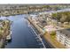 Wide aerial view of a coastal community with luxury homes lining a canal and boat docks at 105 Serenity Point Dr., Little River, SC 29566