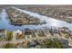 Expansive aerial view of waterfront homes along a canal, showcasing the coastal community at 105 Serenity Point Dr., Little River, SC 29566