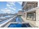 Beautiful backyard pool and hot tub with stunning water views and modern patio at 105 Serenity Point Dr., Little River, SC 29566