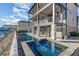 Stunning backyard pool with attached hot tub, perfect for relaxing with waterfront views at 105 Serenity Point Dr., Little River, SC 29566