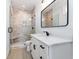 Bathroom features a modern shower, a white vanity with black hardware and a framed mirror at 105 Serenity Point Dr., Little River, SC 29566
