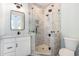 Stylish bathroom featuring glass enclosed shower, black hardware, and bright vanity with plenty of space at 105 Serenity Point Dr., Little River, SC 29566