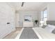 Bright, comfortable bedroom with hardwood floors, modern furnishings, and plenty of natural light at 105 Serenity Point Dr., Little River, SC 29566