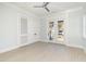 Bright bedroom with ceiling fan, access to balcony, and closet with plenty of storage at 105 Serenity Point Dr., Little River, SC 29566