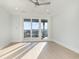 Airy bedroom features a ceiling fan and sliding glass doors leading to a balcony with a view at 105 Serenity Point Dr., Little River, SC 29566