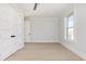 Clean bedroom space features an open hallway, closet, and window with natural light at 105 Serenity Point Dr., Little River, SC 29566