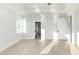 Spacious bedroom featuring hardwood floors, recessed lighting, and multiple access points at 105 Serenity Point Dr., Little River, SC 29566