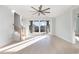Bright, open bonus room with large windows, coffered ceiling, hardwood floors, and access to outdoor views at 105 Serenity Point Dr., Little River, SC 29566
