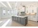 Gourmet kitchen boasts a large center island with quartz countertops and stainless steel appliances at 105 Serenity Point Dr., Little River, SC 29566