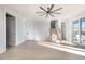Bright living room featuring hardwood floors, statement ceiling fan, and stairs leading to the next level at 105 Serenity Point Dr., Little River, SC 29566