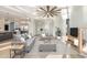Bright living room boasts coffered ceilings, hardwood floors, and access to an open kitchen and sunlit entryway at 105 Serenity Point Dr., Little River, SC 29566