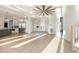 Expansive living room with an open floor plan that flows into a kitchen, doors lead to the outdoors at 105 Serenity Point Dr., Little River, SC 29566