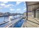 Relaxing waterfront view from the outdoor patio with a luxurious pool and boat docks at 105 Serenity Point Dr., Little River, SC 29566