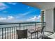 Balcony featuring chairs and table, providing a relaxing space with ocean views at 107 S Ocean Blvd. # 1407, Myrtle Beach, SC 29577