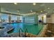 Stunning indoor pool featuring a waterfall feature and beach views, creating a tranquil and luxurious experience at 107 S Ocean Blvd. # 1407, Myrtle Beach, SC 29577