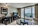 Comfortable living room with ocean views from the balcony and sleek, modern furnishings at 107 S Ocean Blvd. # 1407, Myrtle Beach, SC 29577