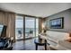 Living room featuring a sliding glass door to a balcony with an ocean view at 107 S Ocean Blvd. # 1407, Myrtle Beach, SC 29577