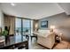 Cozy living room with balcony access and scenic ocean views, furnished with white sofas at 107 S Ocean Blvd. # 1407, Myrtle Beach, SC 29577