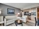 Bright living room with a view of the kitchen, featuring stylish furniture and decor at 107 S Ocean Blvd. # 1407, Myrtle Beach, SC 29577