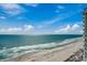 Stunning panoramic ocean view, with a sandy beach and the building's balconies at 107 S Ocean Blvd. # 1407, Myrtle Beach, SC 29577