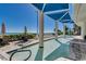 Serene outdoor pool area with lounge seating, lush landscaping, and ocean backdrop at 107 S Ocean Blvd. # 1407, Myrtle Beach, SC 29577