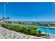 Outdoor pool with beach view, surrounded by lush landscaping and lounge chairs for relaxation at 107 S Ocean Blvd. # 1407, Myrtle Beach, SC 29577