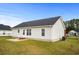 Back exterior of the home showing the siding, patio, and well maintained lawn at 1113 Green Fir Loop, Conway, SC 29527