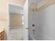 An en-suite bathroom featuring a white tub and tiled shower with a view into the bedroom at 1113 Green Fir Loop, Conway, SC 29527