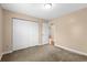 Bedroom featuring neutral walls and carpet flooring, with a door to the hallway at 1113 Green Fir Loop, Conway, SC 29527