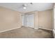Bedroom with carpet, neutral walls, and access to the closet and bathroom at 1113 Green Fir Loop, Conway, SC 29527