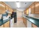Bright kitchen showcases wooden cabinets, modern appliances, and convenient access to dining area at 1113 Green Fir Loop, Conway, SC 29527