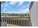 Balcony view showcasing lush greenery, a tranquil waterway, and a clear view of the nearby neighborhood at 121 Osprey Watch Circle # 9-C, Pawleys Island, SC 29585