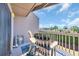 Inviting balcony with Adirondack chairs offers a relaxing outdoor space to enjoy the scenic views and sunshine at 121 Osprey Watch Circle # 9-C, Pawleys Island, SC 29585