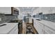 Open kitchen featuring stylish white cabinets and sleek stainless steel appliances at 121 Osprey Watch Circle # 9-C, Pawleys Island, SC 29585