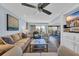 Bright living room boasts comfortable seating and a scenic view from the open balcony at 121 Osprey Watch Circle # 9-C, Pawleys Island, SC 29585