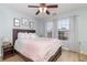 Inviting bedroom with warm hardwood floors, soft lighting, and a view of the outdoors through the window at 1268 Brighton Ave., Myrtle Beach, SC 29588