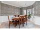 Inviting dining area with a classic wooden table and stylish floral wallpaper at 1268 Brighton Ave., Myrtle Beach, SC 29588