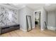 Bright hallway with wood flooring, a full-length mirror, and view of stairs at 1268 Brighton Ave., Myrtle Beach, SC 29588