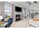 Cozy living room featuring a fireplace, large windows, and comfortable seating at 1268 Brighton Ave., Myrtle Beach, SC 29588
