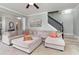 Bright and open living room with a staircase and comfortable sectional sofa at 1268 Brighton Ave., Myrtle Beach, SC 29588