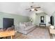 Finished attic space converted into a living room with comfortable sofa, desk and TV at 1268 Brighton Ave., Myrtle Beach, SC 29588