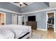 Bright main bedroom featuring a ceiling fan, ensuite bathroom, and a walk-in closet for ample storage at 1268 Brighton Ave., Myrtle Beach, SC 29588