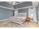 Spacious main bedroom with tray ceiling, large windows, neutral tones, and a comfortable aesthetic at 1268 Brighton Ave., Myrtle Beach, SC 29588