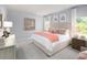 Serene main bedroom with soft lighting, comfortable bedding, and tasteful décor for relaxation at 1384 Palm Springs Paloma Dr, Longs, SC 29568