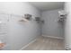Well-organized walk-in closet with ample shelving and hanging space for optimal storage solutions at 1384 Palm Springs Paloma Dr, Longs, SC 29568